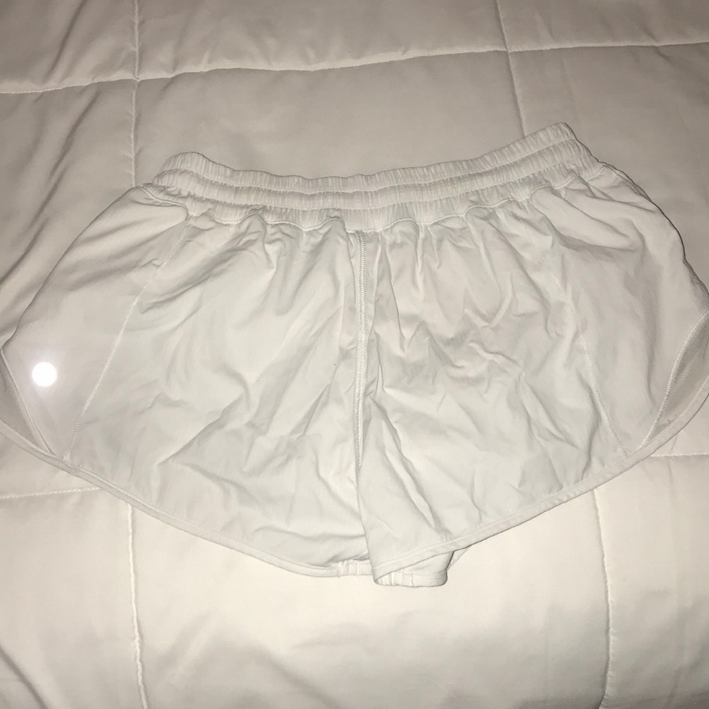 Size 4 white lululemon hotty hot shorts.